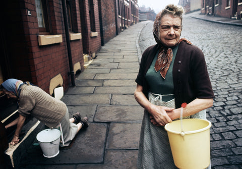 John Bulmer – Old Lady with a Yellow Bucket [Halifax, ENGLAND 1965]